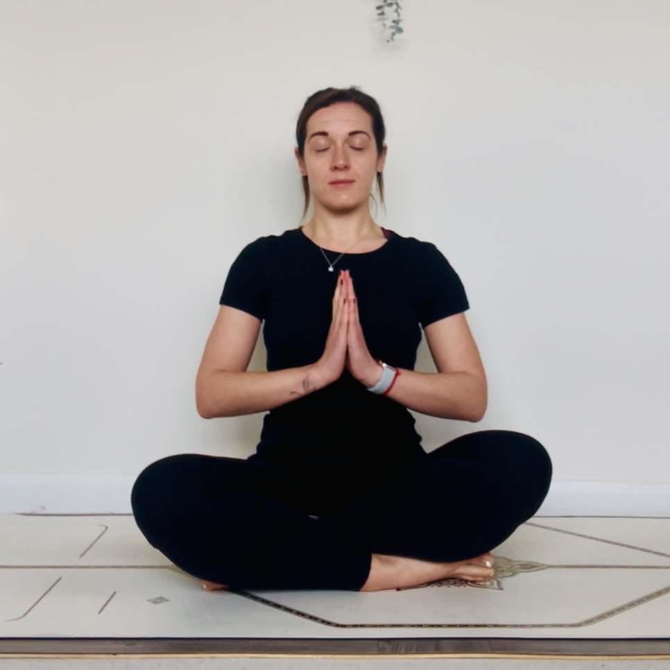 Seated position with hands in prayer in anjali mudra